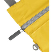 Roka Stratford Recycled Nylon Sling Bag - Mustard Yellow